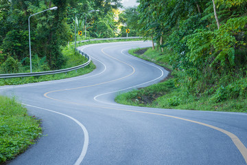 Fototapeta na wymiar Road curves up the mountain in Thailand