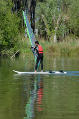 guy doing windsurf in the lake