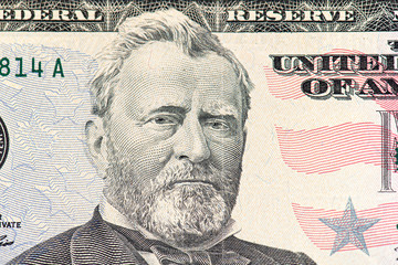 Close-up part of 50 fifty dollar bill with US president Ulysses Grant  face 