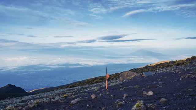 Timelapse view of Kibo with Uhuru Peak (5895m, highest mountain in Africa) at Mount Kilimanjaro, Kilimanjaro National Park. Beautiful landscape with clouds floating over the  volcano.
