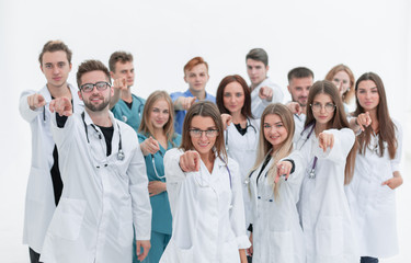 group of diverse medical professionals pointing at you