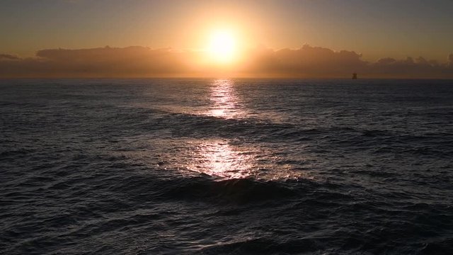 Slow-motion video of the rising sun over the ocean, Australia