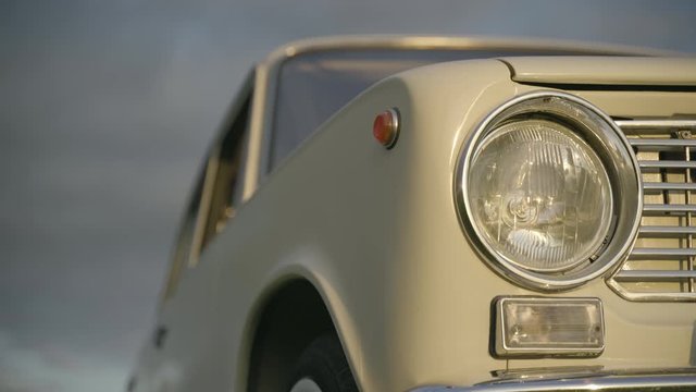 Headlight of old white vintage soviet car