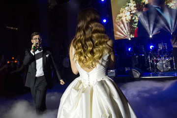 Beautiful wedding couple singing on their wedding