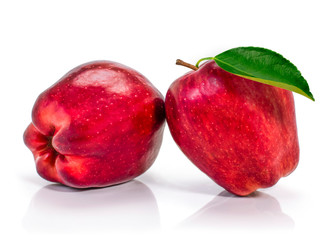 two fresh red washington apple fruits with green leaf isolated on white background.