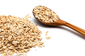 oat flakes and wooden spoon on a white background