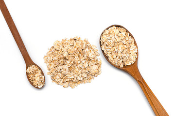 oat flakes and two wooden spoon on a white background