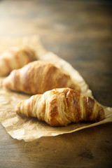 Homemade croissants on a wooden desk