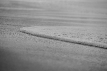 Wave On Sandy Beach. Background. Splash of waves on the sandy beach. foam, surf, waves.