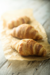 Homemade croissants on a wooden desk