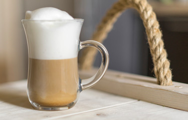 Latte on Rustic Wooden white tray. Shallow depth of field. Copy space.