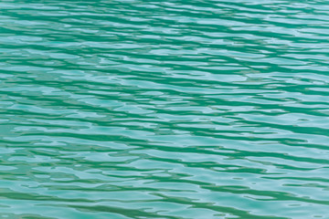Obraz premium Turquoise rippled surface of a lake.
