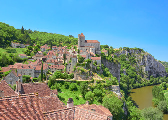 Landscape view of Saint-Cirq-Lapopie, one of the most beautiful villages in France (Les Plus Beaux Villages de France), located on a cliff over the Lot River valley, Causses du Quercy Natural Park