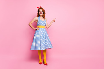Full length photo of astonished lady promoter point index finger copyspace impressed by incredible discount scream wow omg wear blue headband yellow stockings isolated pink color background