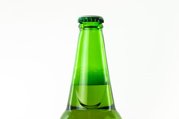 top part of green beer bottle on white background.