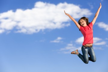 Fototapeta premium Little pupil jump high on the sky background