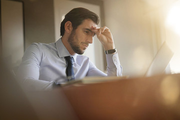 boss in home confinement working on his laptop