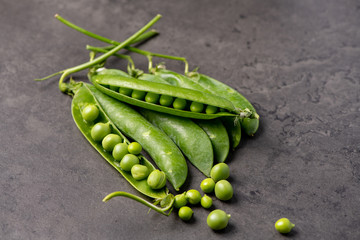 green peas on a wooden background