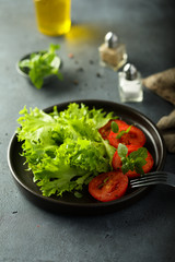 Healthy green salad with fresh tomatoes