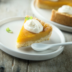 Homemade pumpkin pie with whipped cream