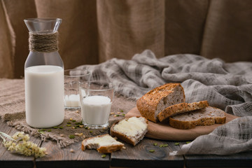 Rustic breakfast with milk and bread. World Milk Day on the first of June. Horizontal shot.