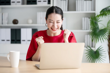 Excited female feeling euphoric celebrating online win success achievement result, young woman...