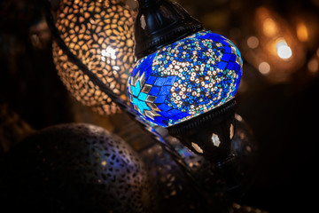 Colorful Moroccan lamp with blue glass mosaic design. Oriental style.