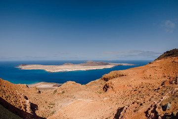 Fototapeta na wymiar View point with La Graciosa, Lanzarote, Spain. Panorama of scenic view of La Graciosa Island