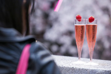 two glasses of strawberry champian or wine  