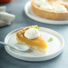 Homemade pumpkin pie with whipped cream