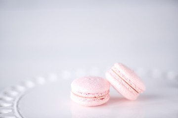 There are two pieces of sweet macaroni on the light table. Space for text