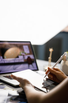 Graphic designer drawing sketch design creative Ideas draft Logo product trademark label brand artwork architecture plan. Graphic designer studio and workspace concept.