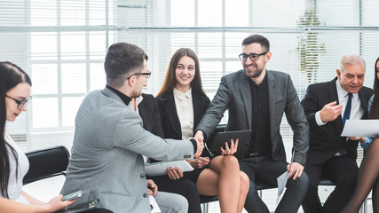business colleagues shaking hands at an office meeting.