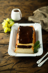 Homemade cheesecake with dark chocolate glaze