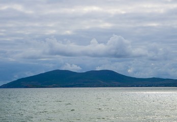 Mountain on Horizon Sea 