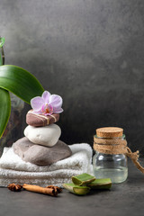 spa still life with towel and orchid  and aloe vera on gray cement background