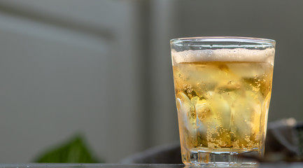 Glass beer on gray background with copy space. and space for text on the right. stay at home.