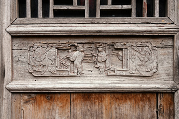 Carved patterns on wooden doors of ancient buildings in Chinese folk villages
