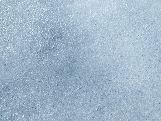 Countryside dug up the ground with the remnants of melted snow in the village in early winter, spring, a puddle, a well, a gazebo, pavers, sunny day outdoor. Russia