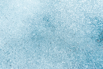 Countryside dug up the ground with the remnants of melted snow in the village in early winter, spring, a puddle, a well, a gazebo, pavers, sunny day outdoor. Russia