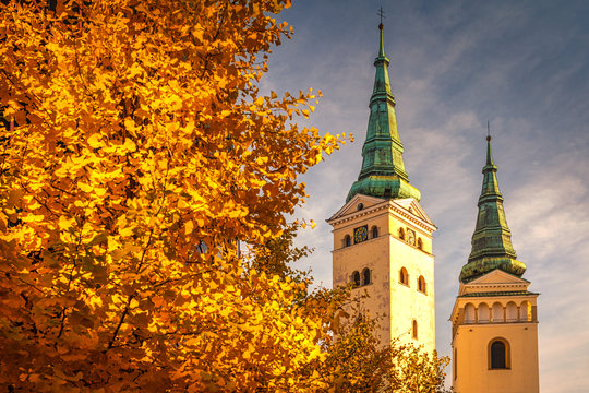 The Zilina town with The Holy Trinity Church tower and The Burian's Tower at autumn, Slovakia, Europe.