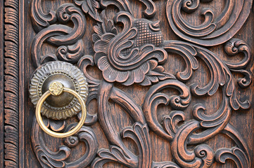Features of carved wooden doors and metal doorrings in Chinese classical architecture