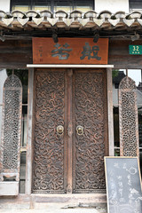 A close-up of wooden doors of ancient Chinese folk buildings
