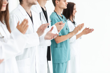 Fototapeta premium close up.a team of leading medics applauding together