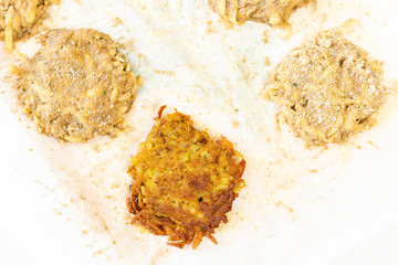 Preparing Raw grated potatoes with breadcrumbs