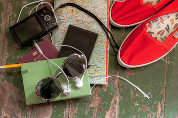 Fototapeta na wymiar Traveler's accessories, Essential vacation items, Travel concept background. Planning a vacation trip. Selective focus