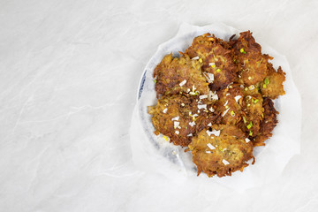 Fried grated potatoes pancakes served on the plate