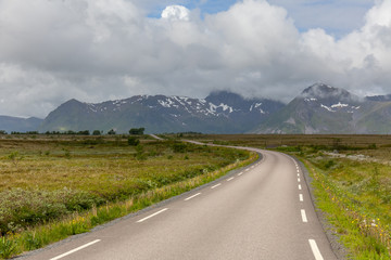 road passing in a valley between mountains in Norway, selective focus