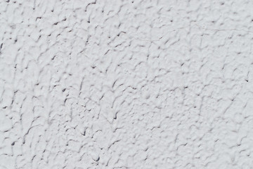 White textured plaster on the wall close up.Creative background,abstract texture.