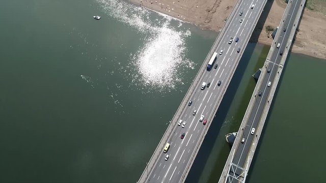 River bridge with heavy traffic of transport from the height of bird flight.